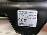 an image of a close up of a metal object with a tag on it