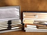 a lot of knives in a case on the table
