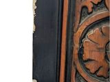 a close up of a wooden door with carvings on it
