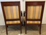 pair of mid century style chairs with upholstered back and arms