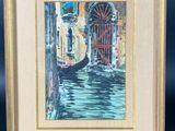 an oil painting of a gondola in a frame on a easel