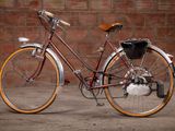a bike that is parked in front of a brick wall
