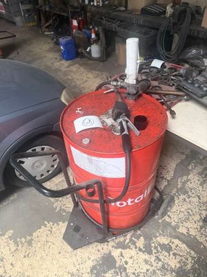 a red fire hydrant sitting in a garage next to a car