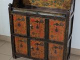 an old wooden cabinet with many drawers on it
