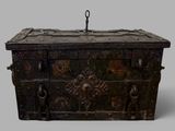 a wooden chest with a metal handle on a gray background