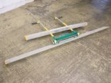 a pair of skis laying on the floor in a garage