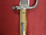 a knife that is laying on a red cloth