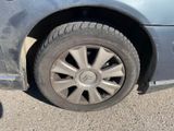 a car that has a flat tire on the road