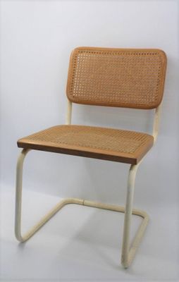 a chair that is made of wood and wicker