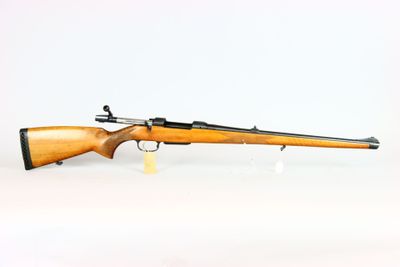 a rifle on a white background with a white background