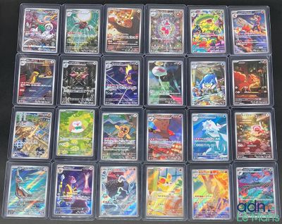 La collection de cartes à collectionner Pokémon est exposée sur une table.