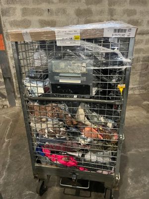 a metal cart with a bunch of items in it