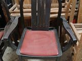 many chairs that are sitting next to each other in a room