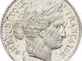 a close up of a coin with a woman ' s head on it