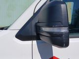 a white van with a red arrow painted on the side of it