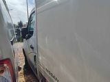 two trucks parked next to each other on the side of the road