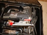 a black box with tools inside of it on the floor