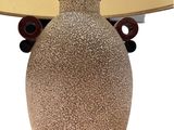 a lamp that is sitting on a table next to a lamp shade