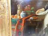 un tableau représentant une femme tenant une assiette de nourriture