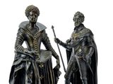 statue of a man and a woman dressed in medieval clothing