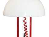 red and white table lamp with a cord attached to it