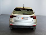 a picture of a silver car parked in a white room
