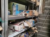 many boxes and boxes on the shelves in the room