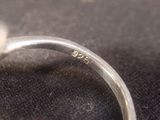 a close up of a ring on a black surface