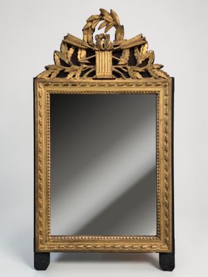 Miroir en bois et stuc doré de style Empire orné de flèches …