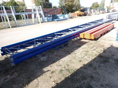 a large long metal structure sitting on the ground