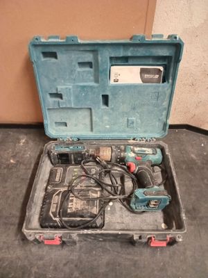 a tool in a case that is sitting on the floor
