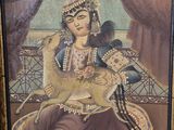 tableau encadré représentant une femme avec un oiseau sur l'épaule