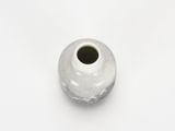 a white vase that is sitting on a white surface