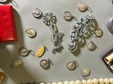 many different types of jewelry on the table