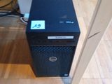 a black computer tower sitting on a hard wood floor