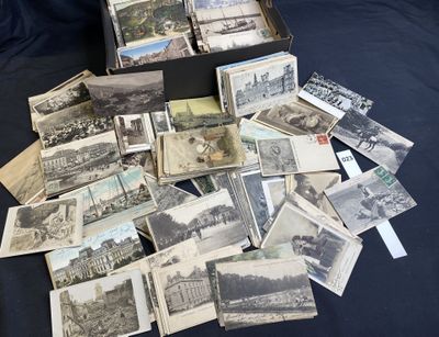 a black box full of old postcards on a table
