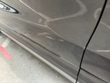 a close up of a car ' s door handle with a sticker on it
