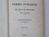 an open book on a white table with a black and white image
