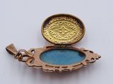 a gold locke with a blue glass inside of it