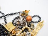 a close up of a necklace with many different items on it