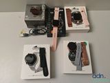 a box of watches and a watch on a table