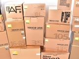 many boxes stacked on top of each other on the floor