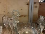 a lot of glass dishes and bowls on the table