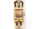 an image of a woman ' s wrist watch with diamonds on it