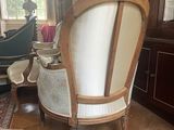 a chair that is sitting in the middle of a room