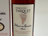 a bottle of wine sitting next to a box of wine