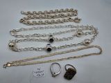 a close up of a bunch of jewelry on a table