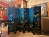 a room divider with a fish scene painted on it