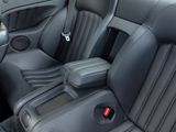 the interior of a car with black leather seats and a center console
