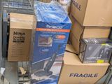 many boxes of vacuum cleaners on the floor